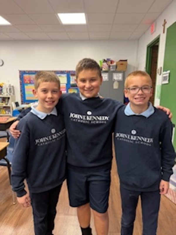 kids wearing school sweaters